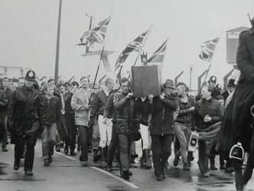 National Front marchers surrounded by police as they demonstrate about the demise of Fleetwoods fishing industry in October 1982