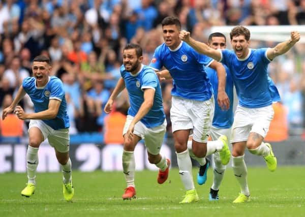 City players celebrate after Gabriel Jesus' winning the penalty in the shootout