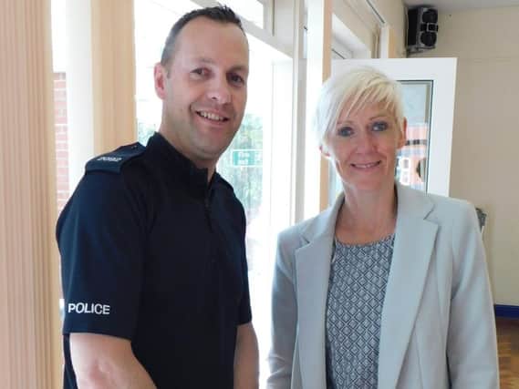 PC Ian Ashton and N-Visions community services manager Maria Kirkland
