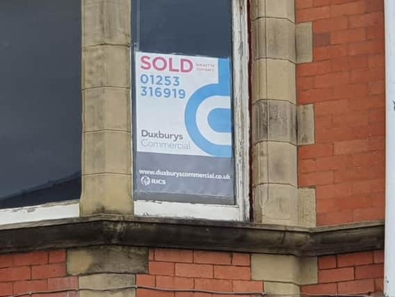 Sold signs have gone up at the building