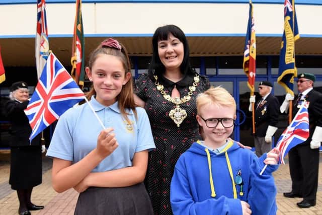 Isabella Bradley-Ela and Elliott Hamlett from Anchorsholme Academy with Blackpool Mayor Amy Cross at an event as part of Armed Forces Week