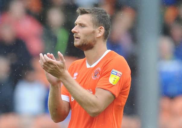 Blackpool defender Ryan Edwards says everyone will keep their feet on the ground