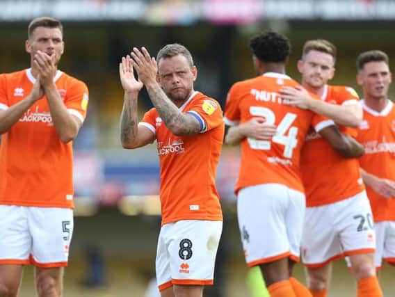 Blackpool's players applaud the fans after making it two wins from two