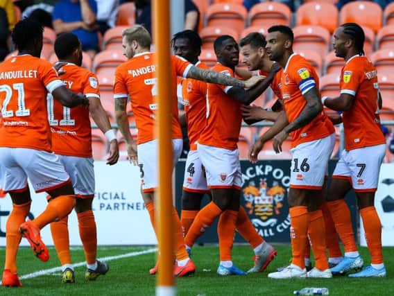 Blackpool celebrate Ryan Edwards' opening goal against Oxford