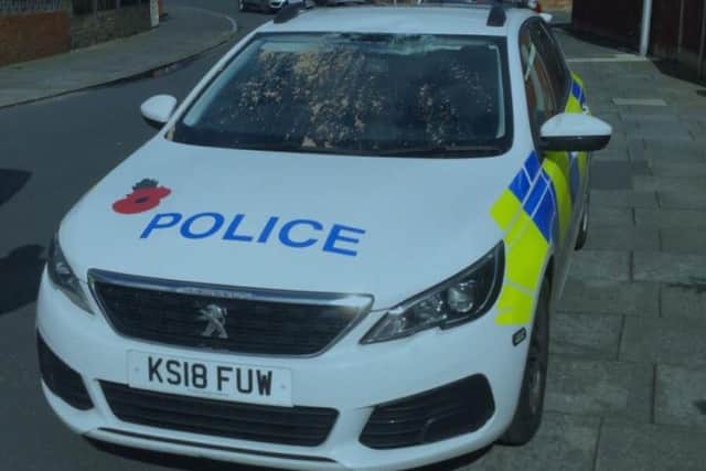 A 29-year-old man has been charged with criminal damage after climbing onto a police car in Blackpool and causing damage to the roof and window