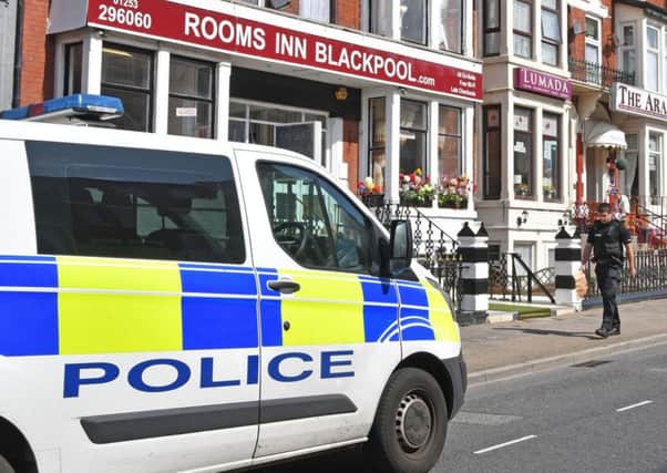 A police officer outside the Rooms Inn hotel in Albert Road, Blackpool, after a girl, two, fell from a second-floor window shortly before 9am on Tuesday, August 20, 2019 (Picture: Dave Nelson)