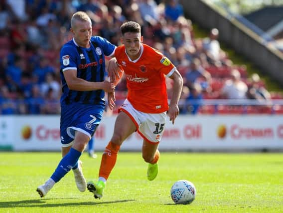 Jordan Thompson on the attack for Blackpool at Rochdale