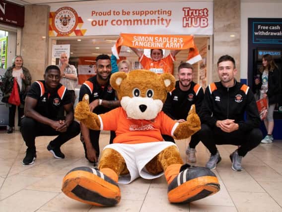 Bloomfield Bear and four first-team players helped open Blackpool's new unit in Houndshill Shopping Centre