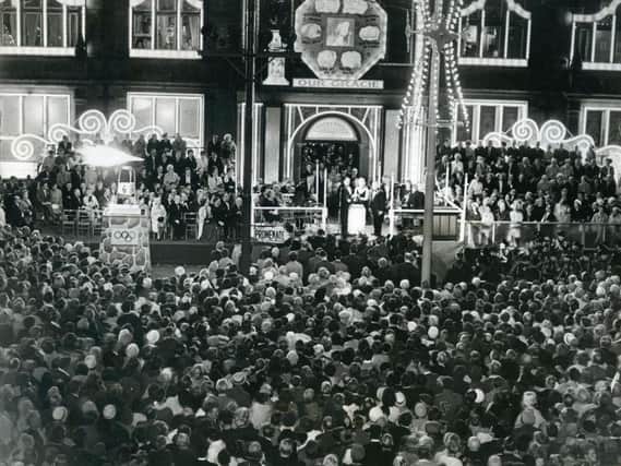 The crowds gather to watch Gracie Fields switch on the lights in 1964