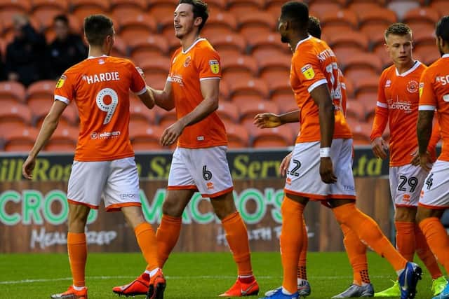 Ben Heneghan celebrates scoring Blackpool's first goal of the night