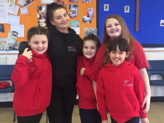 Ellena Morgan with youngsters at Little Voices Fylde Coast