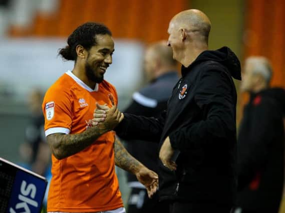 Simon Grayson congratulates Sean Scannell at Bloomfield Road on Tuesday