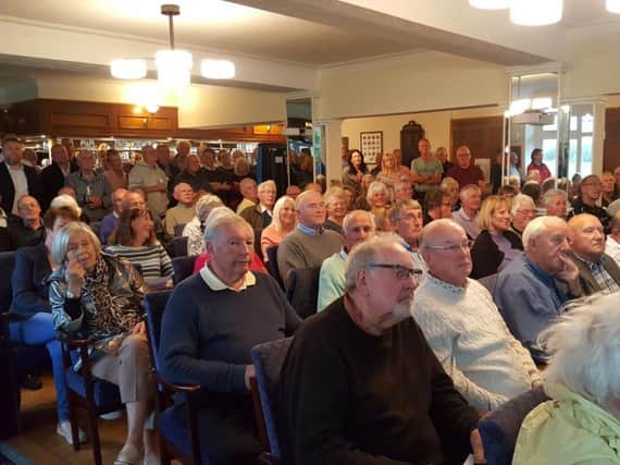 Residents packed into the public meeting