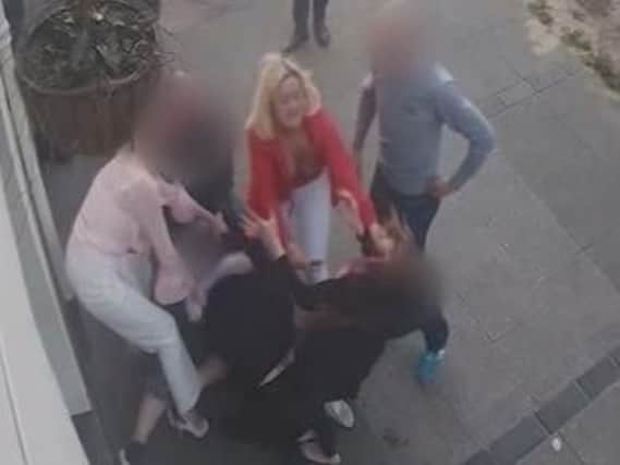 The street fight, which happened outside The Bull in Waterloo Road, South Shore, landed care worker Chelsea Bryan (pictured above in red) in court (Picture: Crown Prosecution Service)