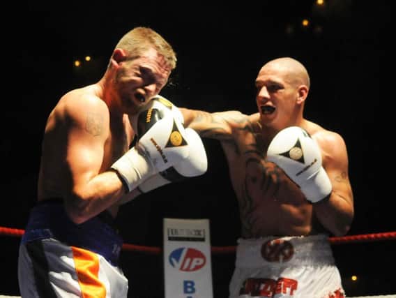 Jeff Thomas, right, pictured during his last pro fight in 2012