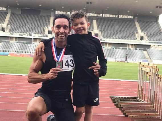 Dave Mendonca with son Diego and his British Masters gold medal in Birmingham