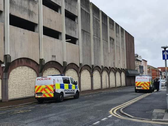 A section of Blackpool town centre has been cordon off after a woman fell from the Wilko building in Queen Street this morning (October 10)
