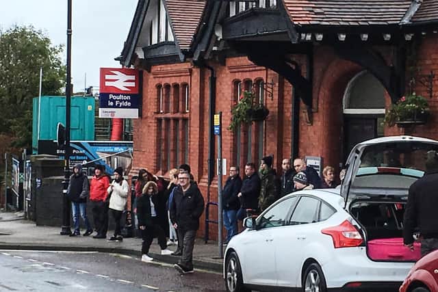Stranded passengers at Poulton train station after services were cancelled between Preston and Blackpool due to flooding (October 11) Credit: Nodrog