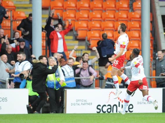 Robertson celebrates scoring against his former club