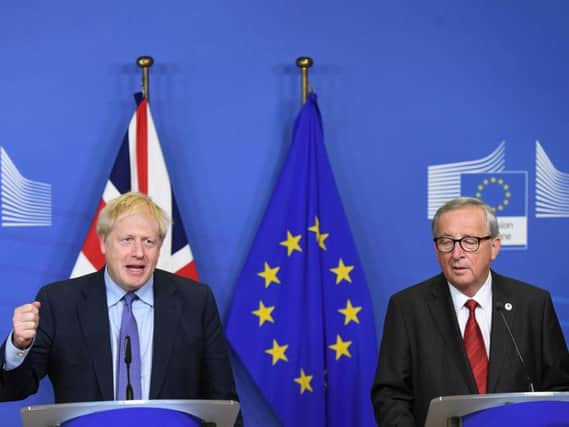 UK Prime Minister Boris Johnson and Jean-Claude Juncker, President of the European Commission, ahead of the opening sessions of the European Council summit at EU headquarters in Brussels. Photo credit: Stefan Rousseau/PA Wire