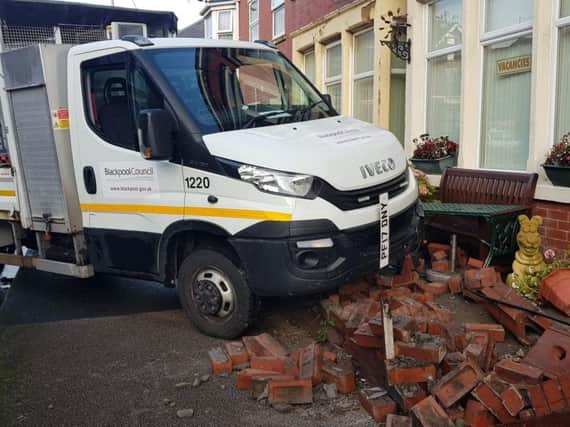 The council van crashed through a wall