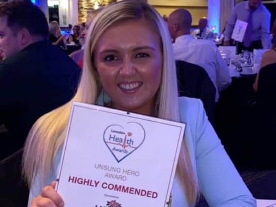 Chloe Doherty, 21, of Staining, is a student nurse aiming to set up a free social service. She is pictured here with her highly commended award for Unsung Hero at the Lancashire Health Awards
