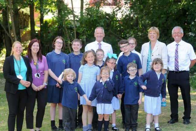 Staff and pupils at Park School celebrate after being rated outstanding again by Ofsted. Senior leadership team, Vicky Heaney, Annie Millard, Keith Berry, Gill Hughes and Stuart Bradford with some of the pupils