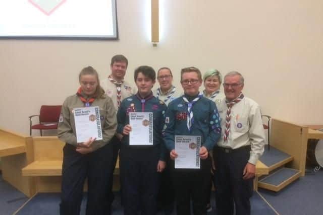 Scouts proudly display their chief scout certificates