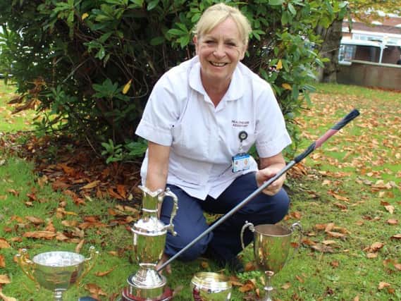 Audrey Bramhall with her impressive haul of golfing trophies