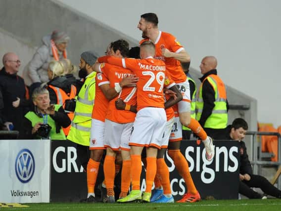 Blackpool's players celebrate their fourth goal of the day