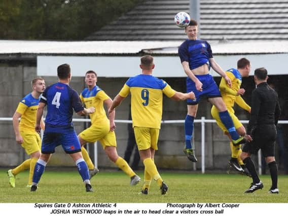 Josh Westwood climbs highest for Squires Gate against Ashton Athletic Picture: ALBERT COOPER