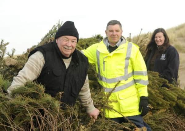 Coun Tony Ford, senior coast and countryside officer Geoff Willetts and sand dunes project officer Lynn Ashton on the sand dunes.