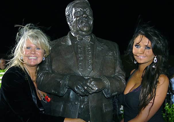 Pictures Martin Bostock. Unveiling of the Les Dawson statue on St Annes promenade.  Tracy Dawson and daughter Charlotte Dawson with the statue.