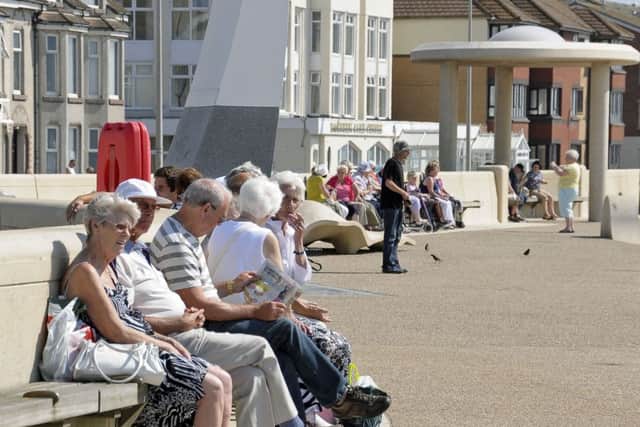 People enjoying the sunshine on Cleveleys promenade.
