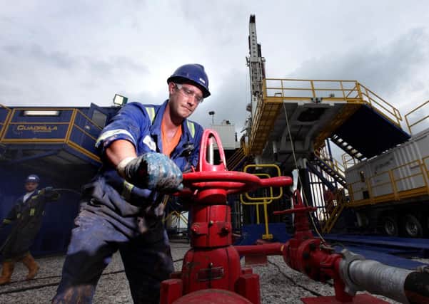 A worker at one of Cuadrilla Resources' fracking sites and (below) the Rt Hon The Lord Howell.