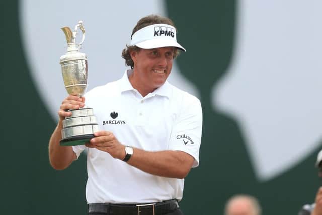 Phil Mickelson celebrates with the Claret Jug after winning the 2013 Open Championship at Muirfield Golf Club, East Lothian.
