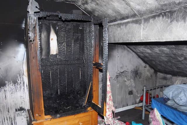 The bedroom at the Freckleton bungalow on Lytham Road, where a fire broke out on January 7, 2012, killing siblings Holly and Ella, Jordan and Reece Smith. Below: Dyson Allen.