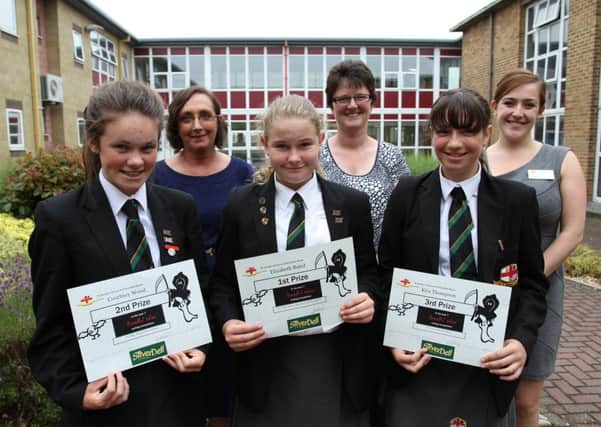 Pupils Courtney Wood, Elizabeth Baird and Kira Thompson with teachers Mrs Monk and Mrs Streetly and (centre) Elaine Silverwood