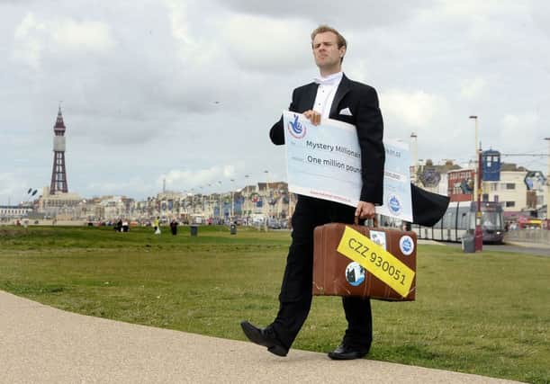 Euromillions Butler Tarquin Fotheringill arrives in Blackpool to search for the mystery millionaire.