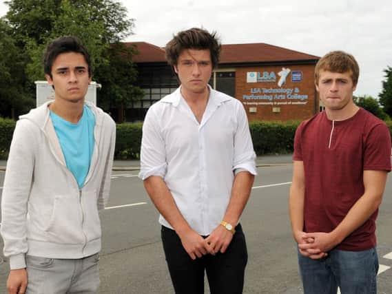 Former Lytham St Annes High pupils who have been employed as school cleaners have been overpayed - and have now been threatened with court action by the county council. L-R James Perry, Lewis Thompson and David Rothwell.