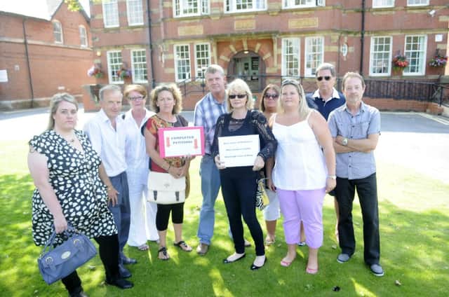 Warton residents hand in a petition at Fylde Town Hall against plans to build hundreds of homes in the area.