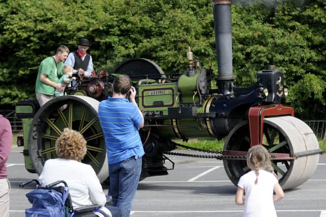 Fylde Rugby Club family fun day.  Brendan Malone with son Rory Malone drive a steam roller with help from Ed Tatham.