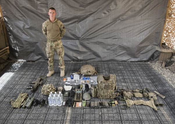 Kingsman Sam Taylor with the kit he would need on a 24 hour patrol in Afghanistan.
