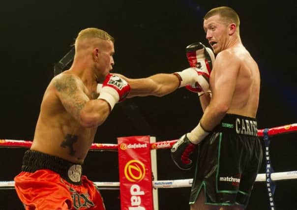 Gary Fox (left) in action against Scott Cardle in the lightweight at the SECC, Glasgow