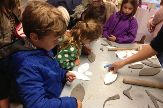 Youngsters making clay leaves and putting on a show for the open day of Lansdowne Road Park, Ansdell.