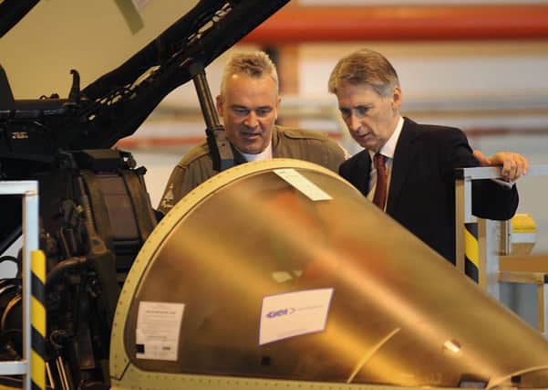 The Secretary of State for Defence Philip Hammond visited the BAE Systems site at Warton . The Secretary of State is shown the cockpit of a Eurofighter Typhoon .