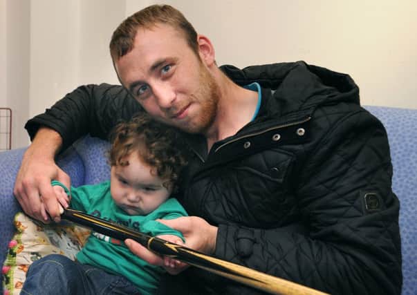 Ben Spriggs, whose son Malachy is a patient at Brian House, is setting up a charity snooker tournament to raise funds for the Hospice Heroes campaign.
Ben and Malachy with Ben's treasured old snooker cue.  PIC BY ROB LOCK
21-10-2013