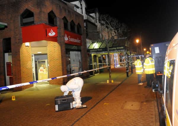 Forensic officers outside Santander in Lytham on Tuesday night.