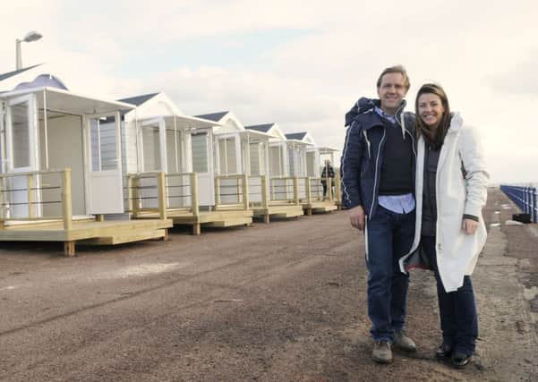 Stuart and Zoe Robertson outside the beach huts at St Annes.