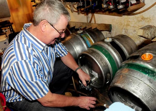 Steve Dilworth tends to his ale at the award winning Swan with Two Necks pub.
Photo Ben Parsons